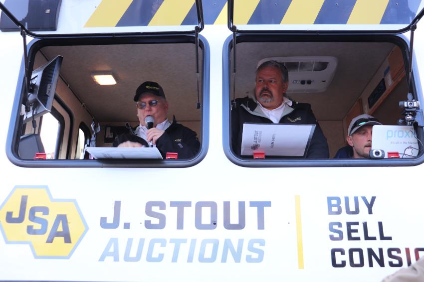 Auctioneer Randy Grudzinski (L) and General Manager Neil Gardner are taking in live bids during the fast-paced auction, while Proxibid and BidCaller are taking in online bids.  
