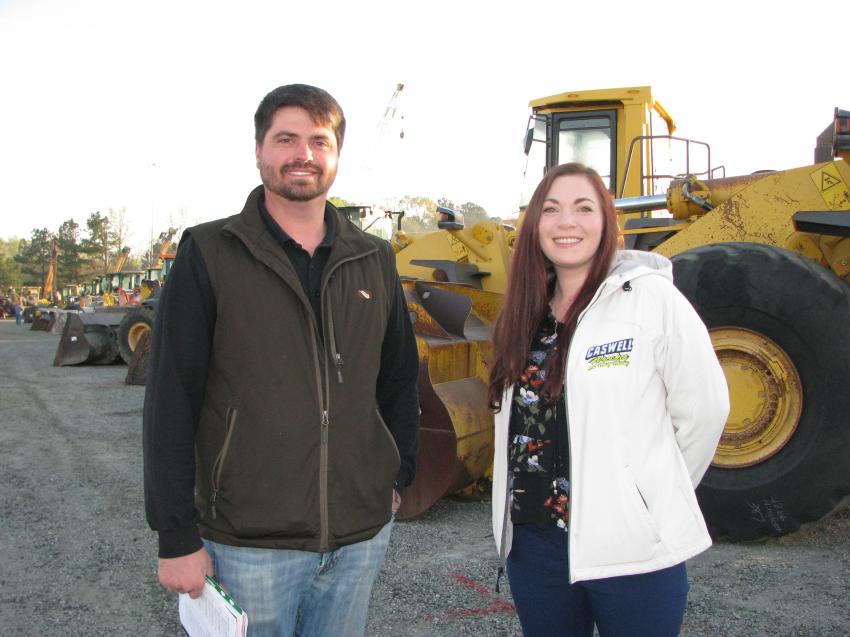 Getting an early-morning look at some of the trucks and machines of interest are Josh Harris (L) and Ashleigh Trumpour of Caswell Wrecker & Heavy Haul, Newnan, Ga.
