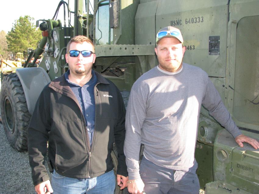 There is always a good selection of military machines at the auction. Hopeful to get a bargain on a John Deere 624 loader are Rick Webb (L) and Jim Mosley of Alpha Equipment, Plant City, Fla.  
