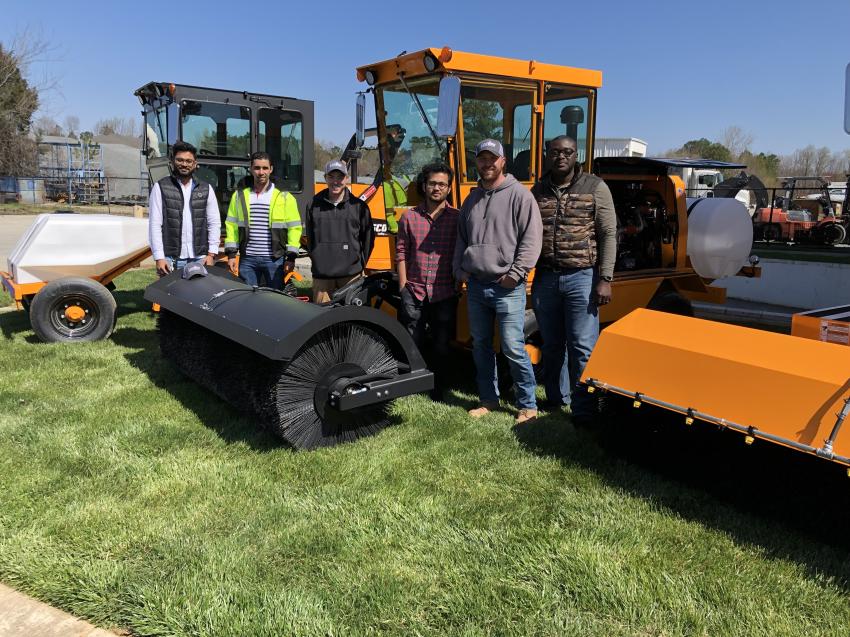 (L-R): Rushi Kagade, Anouar Fennouri, Drew Pitman, Krishna Deshmukh, Ben Cope and Francis Boafa, all of Sugar Creek Construction LLC in Charlotte, N.C,. inspect the RB50, a self-propelled broom that features well-thought-out control placement and heightened visibility that makes this machine easy to operate.

