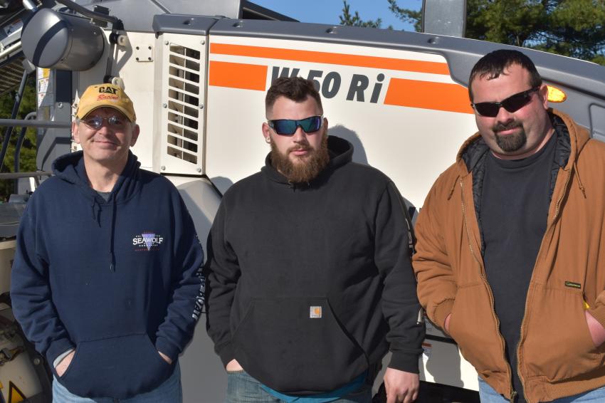 (L-R): Daniel Roux, Jacob Pudsey and Tyler Noland, all of American Industries in Plainfield, Conn., are checking out the milling machines offered by the Wirtgen Group and W.I. Clark.
