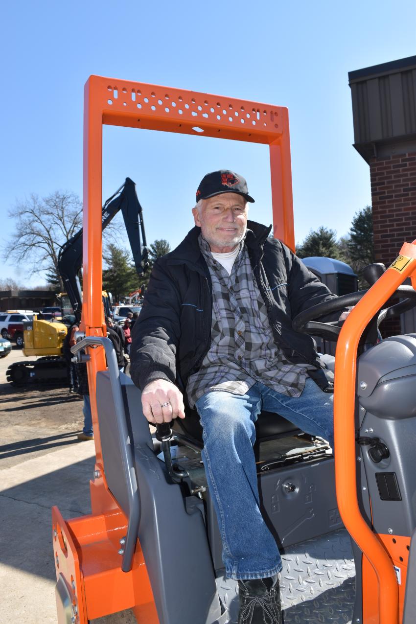 Getting some seat time in a Hamm roller is Peter Ambrighetti, a paving contractor in northwest Connecticut.
