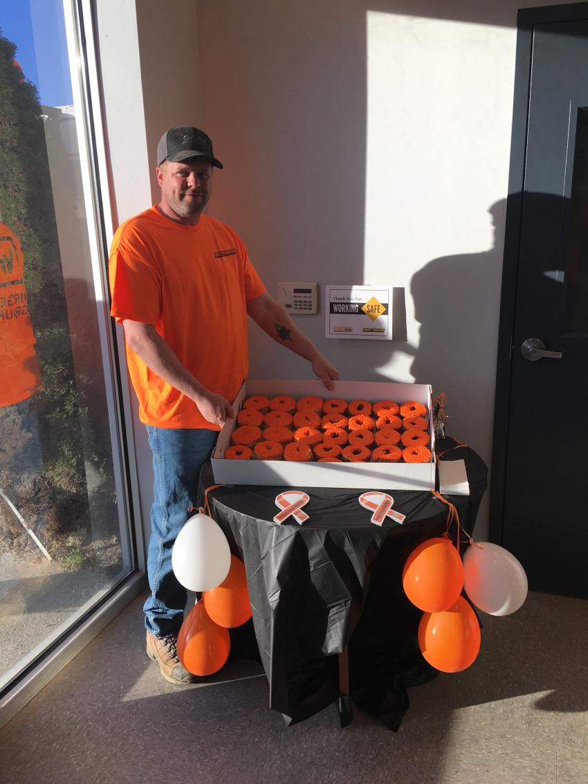 Eric Sparks, field technician of Groff Tractor in New Stanton, stands by orange “safety donuts,” which were available to all Groff Tractor customers on April 10.