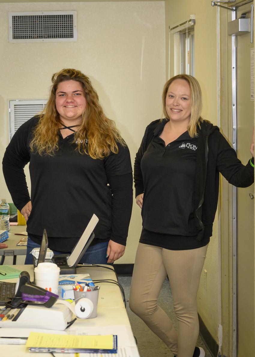 Madison Moon (L) of Cicero, N.Y., and Kasey Helm of Fulton, N.Y., are traveling office asssistants of Alex Lyon & Son. They can be found in the settlement office and will assist in getting attendees registered to bid.