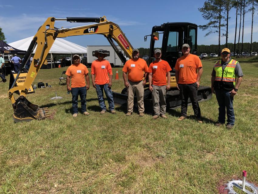 (L-R): Felix Garcia, Hermilo Cortes, Kit Rowe, Colie Rowe and Joseph Branham, all of M.C. Rowe Construction in Ridgeway, S.C., and Roger Wise, Blanchard Machinery, inspect the Cat 305.5E2 CR hydraulic mini-excavator, which delivers high performance, durability and versatility in a compact design. 