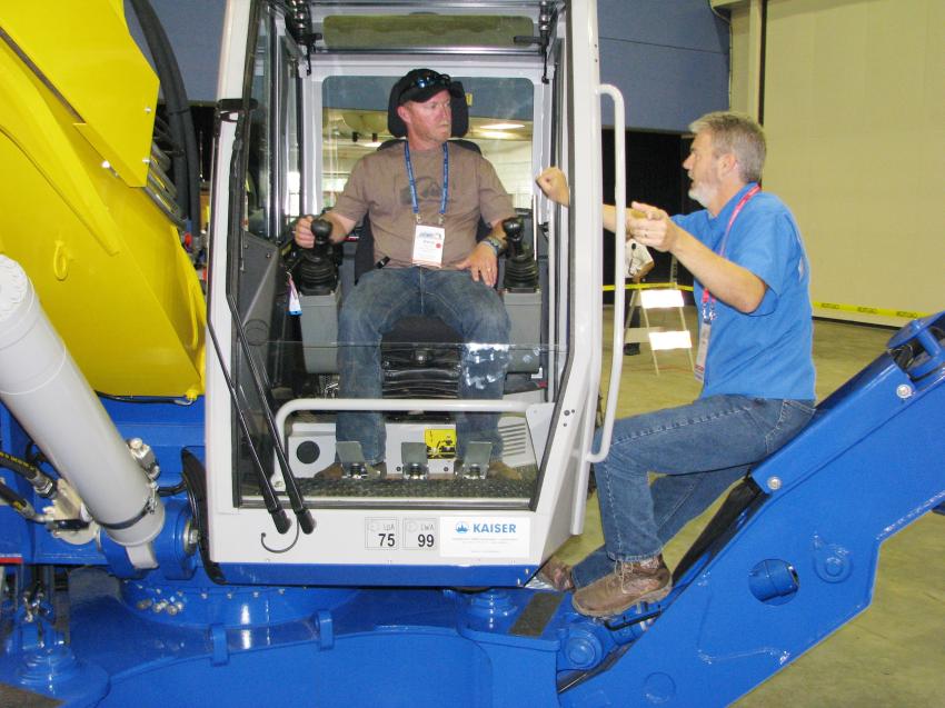Dave Lecour (L), heavy equipment operator of the city of Palm Bay, Fla., gets some operational tips from Steve Tuton of Great Southern Equipment, Tampa, on the operation of the Kaiser S2 Gator in the APWA equipment rodeo.