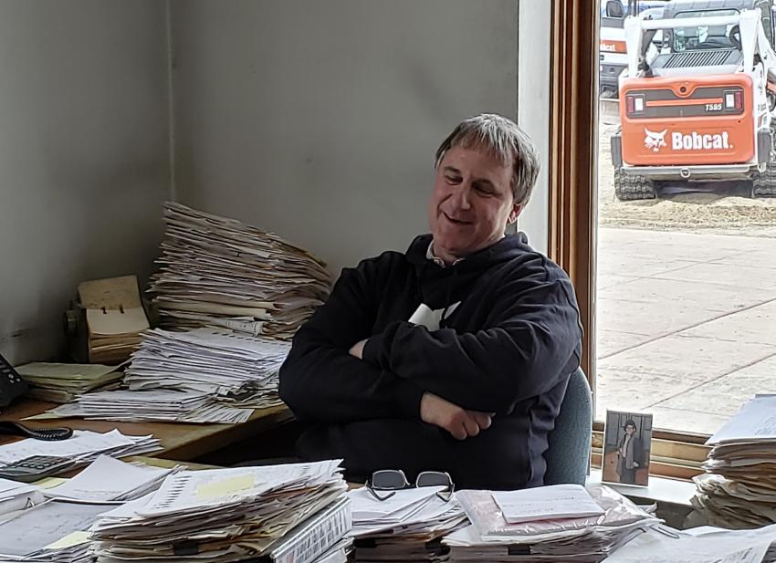 Tim Cox, president and co-owner of Farm-Rite Equipment, takes a break in his office during the Dassel open house. Farm-Rite has locations in Dassel, St. Cloud and Willmar, in addition to its newest location in Long Prairie, Minn.