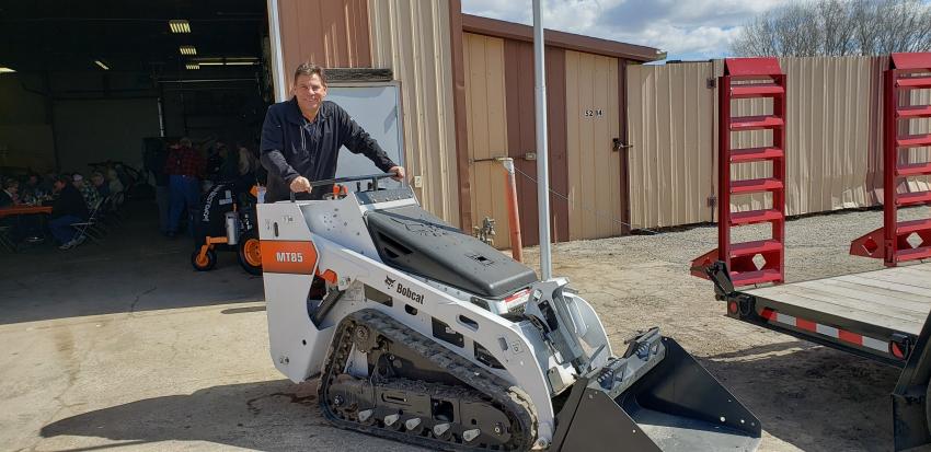 Tim Krahn, Bobcat regional sales manager, tries out one of his favorite machines, the MT85 mini-track loader, at the St. Cloud open house.