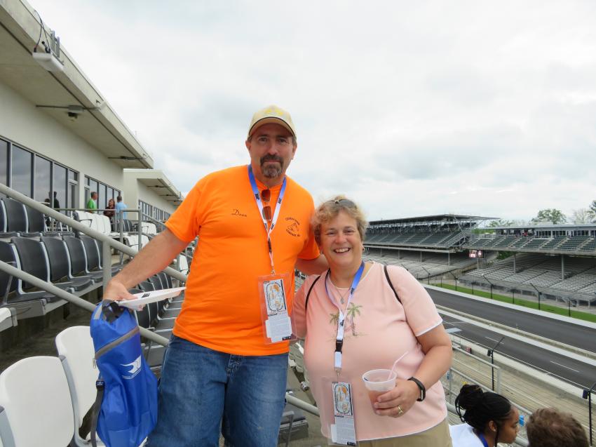 Viewing the famed Indianapolis Motor Speedway from the outside seating area in the Mi-Jack Suite are Dean Bricker and Glenda Snyder, both of Crisman Sand Co. Inc.
