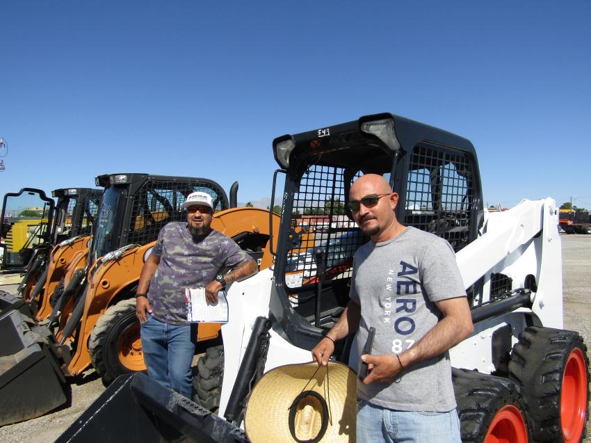 Carlos Lopez (L) and Cesar Gonzalez of Dave’s Electric in Las Vegas, finishing up a walk-around inspection on this 2012 Bobcat S630 skid steer.

