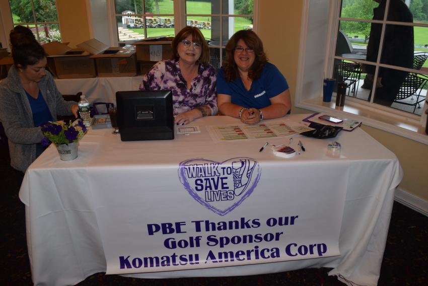 Denise Harrison (L), American Cancer Society volunteer, and Holly Bodnar, marketing manager of Komatsu.
