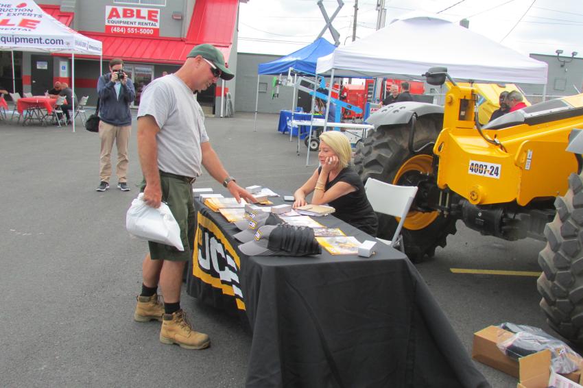 Maeve McPhail, regional manager, direct sales, JCB, discusses JCB equipment options with Joe Siekonic, groundskeeper of East Penn School District.
