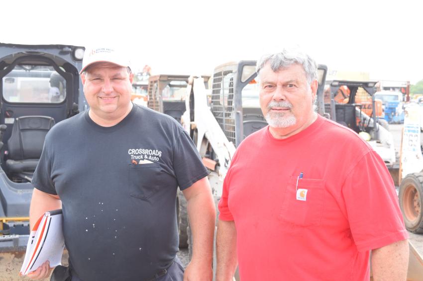 Brian DiMaggio (L), owner of Cross Roads Truck & Auto in Westminster, Md., and Dan Bleclic, assistant, are ready to add to their equipment fleet during the Ritchie sale.