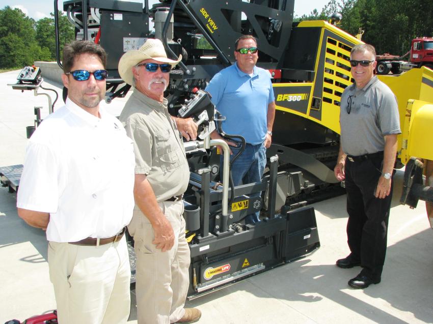 (L-R): Warrior Tractor’s Mike Sims; Tommy Self of Sundog Paving, Sayre, Ala.; Henry Polk and Jerry Fitch of Bomag, Ridgeway, S.C., talk about the products on display in the Bomag exhibit area, including the all-new BF 300 paver introduced earlier this year. 
