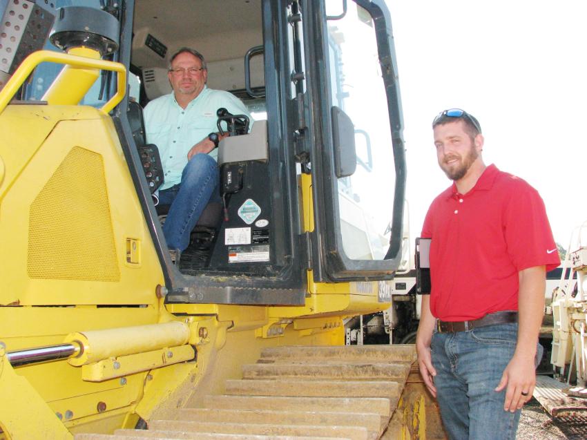 Roger McCool (L) and Steve Minderlein of Lyle Machinery, the local Komatsu dealer, were out taking a look at a stout selection of Komatsu dozers and were monitoring the pricing as they rolled across the auction “block.” 