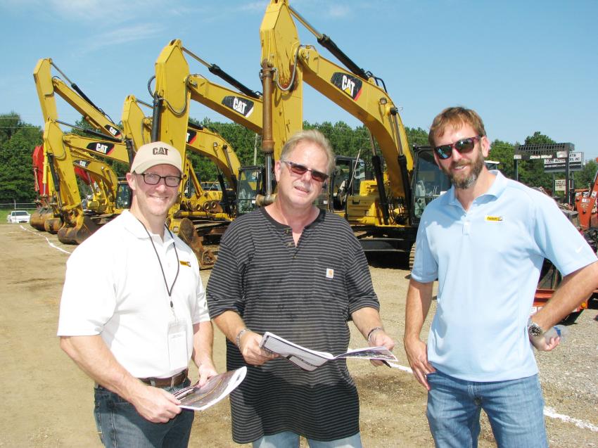 Coming out to see the auction action on construction equipment sale day (L-R) are David Fisher, Caterpillar Financial Services, Hattiesburg, Miss.; Russell Miller, Miller Enterprises, Hattiesburg, Miss.; and Kyle Kimbrough, Puckett Machinery Cat, Hattiesburg, Miss., branch location.