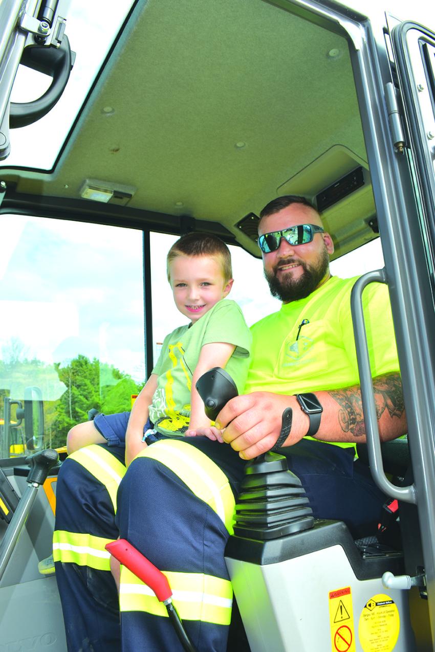 Matt Humphrey, utility technician and yard coordinator of Chadwick-BaRoss, takes this opportunity to introduce future operators to the control systems of a Volvo excavator.
