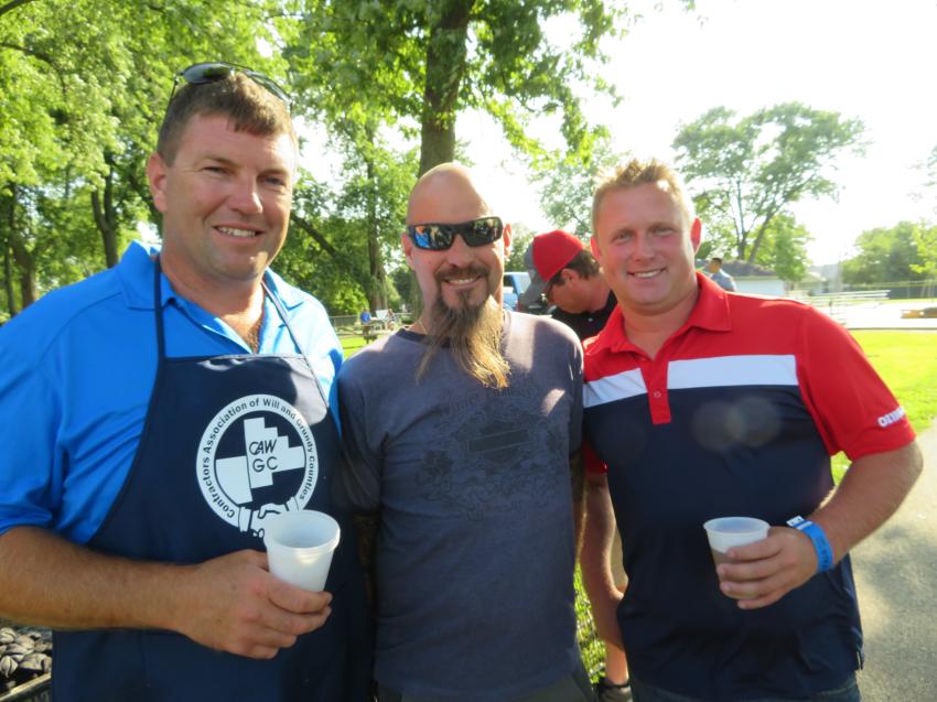 (L-R): Nick Stipanovich of Illinois Truck & Equipment Co. Inc. takes a break from grilling to say hello to George Petecki of George’s Landscaping Inc. and Norm Beasley of Ozinga Ready Mix.
