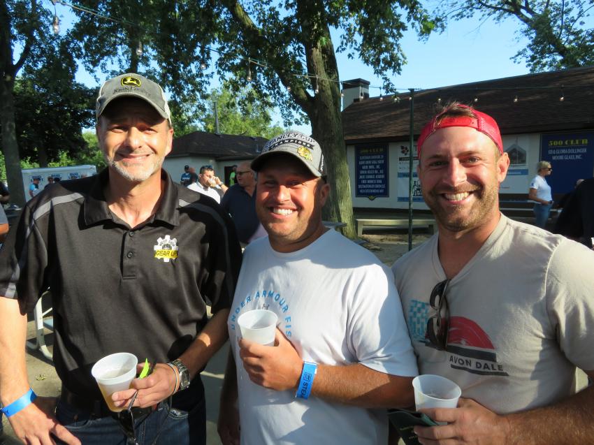 (L-R): Wayne Massad of West Side Tractor Sales Co. is enjoying the annual Steak Fry with Chris and Tyler Lepretre, both of Lepretre Excavating.
