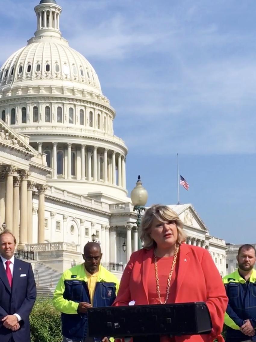 Diane Benck speaking in Washington, D.C., as AED Chairwoman. 
