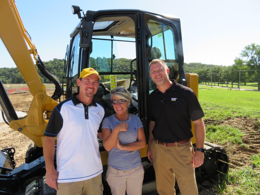 (L-R): In front of the Cat 308CR mini-excavator are Rob Riggs and Lisa Barnhart, both of Riggs LLC, and Matt Jundt of Fabick Cat.
