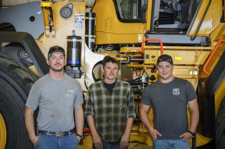 (L-R): Rob Rand, Hayden Cyr and Mike Mosher enjoy the celebration in front of the Volvo L260H.