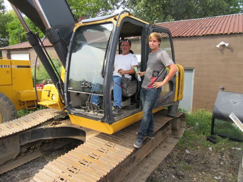 Luke (L) and Ernie Jenkins of Jenkins Recycling review the excavators for their Norwalk, Ohio, recycling operation.
