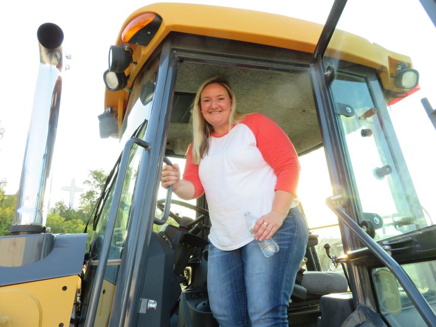 Stacy Friederich of Midwest Underground is ready to try out this John Deere 310 backhoe loader.
