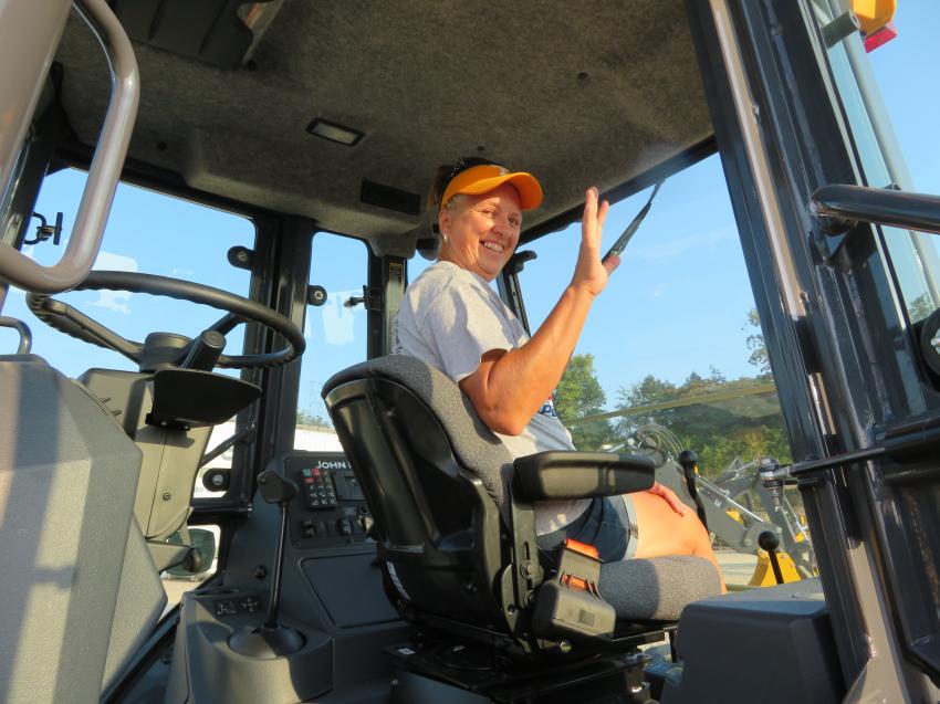 Cindy Thorn of Midwest Construction Services is at the controls of this John Deere 410SL backhoe.
