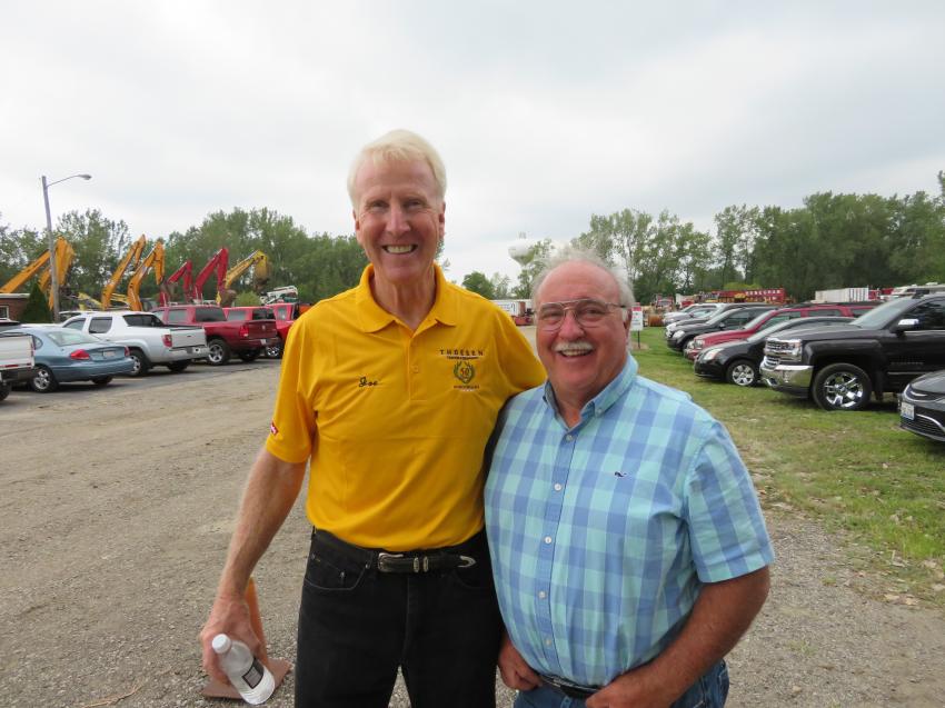 Joe Thoesen, president of Thoesen Tractor & Equipment, welcomes Bobby Madden of Bigane Paving to the 50th anniversary celebration.
