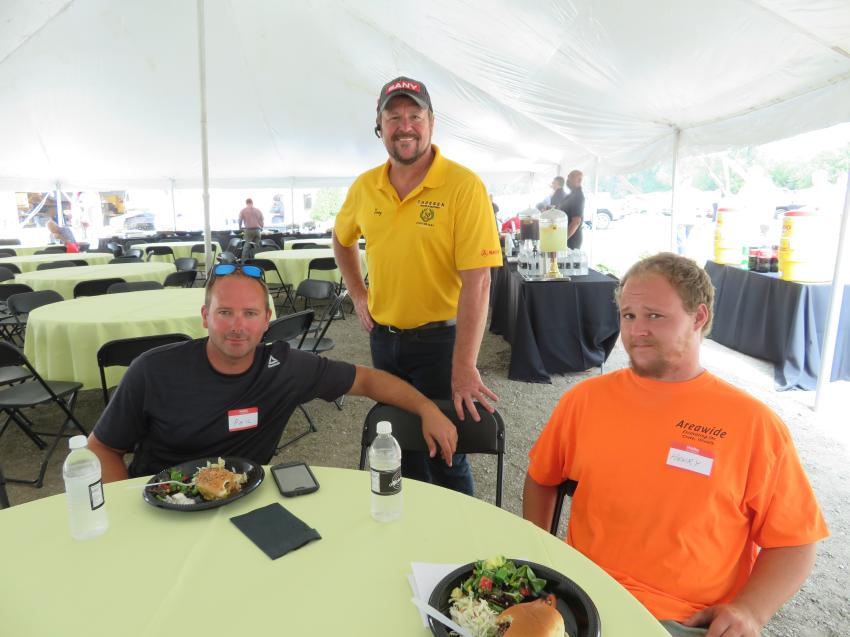 Troy Tate (C) of Thoesen Tractor & Equipment with Phil Moeller (L) and Henry Benoit of Areawide Excavating Inc.
