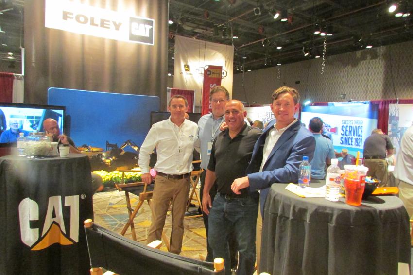 Joe Porchetta (third from L) of GMP Contracting. South Plainfield, N.J., visits with Ryan Foley (L), president; Jeff Merle, vice president of machinery sales; and Jamie Foley, CEO, all of Foley Inc.
