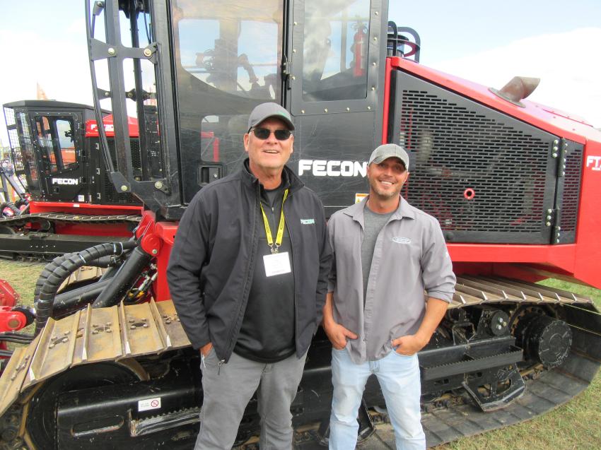Regional Manager Bob Candee (L) received an assist at Fecon’s equipment display from Matt Bentz of Company Wrench.

