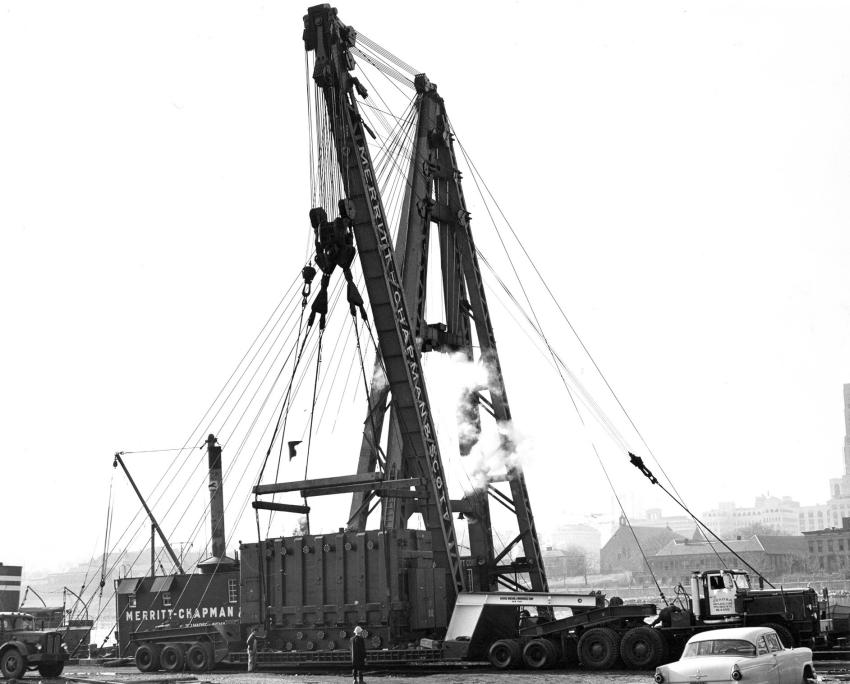 Rogers Bros. Corporation photo
Two famed NYC based firms, Merritt Chapman & Scott and Gerosa Haulage Corporation transfer a huge transformer from land to sea with the help of a massive custom trailer built by Rogers Bros., ca. late 1950 to 1960. The heavy haul tractor is a Mack LRSWX.