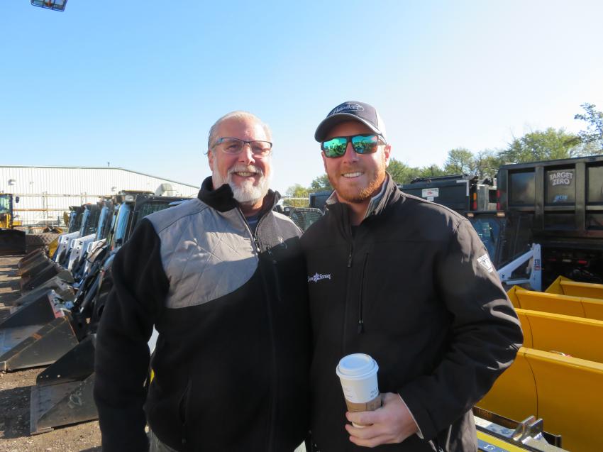 The father and son team of Jim (L) and Trevor Biebrach, owners of Snow Systems, look over the sectional snow plows at the Oct. 12 auction.
