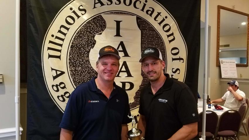Scott Hoglander (L) of Ritchie Bros., Josh White and Bob Martin (not pictured) of Martin Equipment finished the day with third-place honors and a score of 61 at WeaverRidge.
