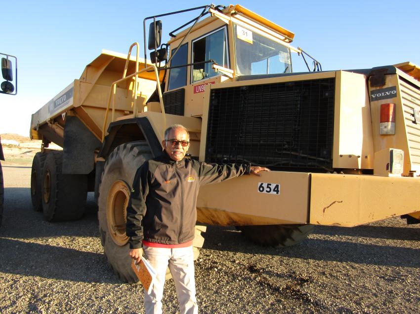 Based in Phoenix, Heavy Equipment Transportation’s Eddie Morales checking the specs on this 1997 Volvo articulated dump truck for possible transport.
