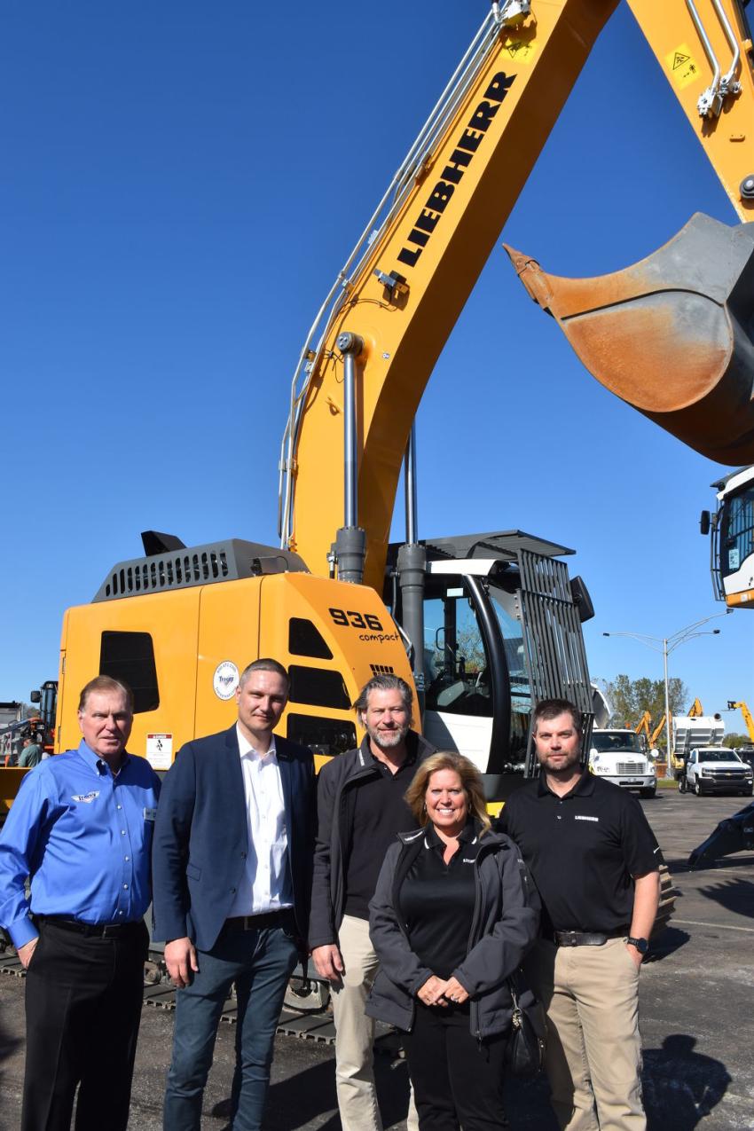 At 35 tons, this is one of the largest zero tailswing excavators available in its size category and offered by Liebherr. (L-R) are Jerry Tracey, president and founder of Tracey Road Equipment; Lasse Laanikari; Peter Mayr, president; Cheri Cooke; and Mike Balella, all of Liebherr North America.