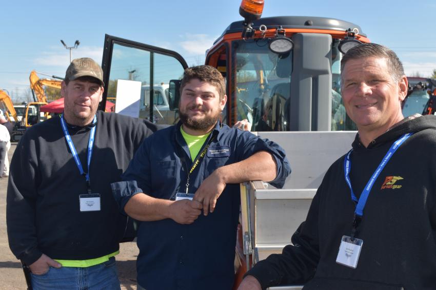 Highway departments are sure to be impressed that nearly every single item from truck to snowblower to wheeled excavator is available at Tracey Road Equipment, a one-stop shop.  (L-R) from the town of Sullivan are Ron Kingsley, Pete Compoli and Carl Magdziuk.