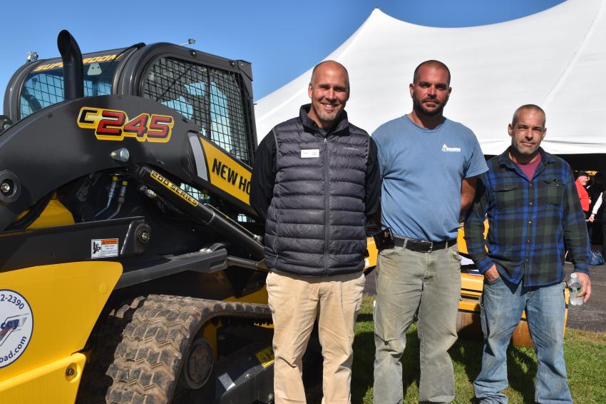These three gentlemen are big fans of the New Holland line of compact construction equipment. (L-R) with this New Holland model 235 skid steer are Scott Thayer of Tracey Road Equipment; Paul Doupe of PD Enterprise, a landscape and excavation contractor, who currently has three New Holland skid steers in his fleet that were purchased from Tracey Road Equipment; and Steve Doupe, also of PD Enterprise.