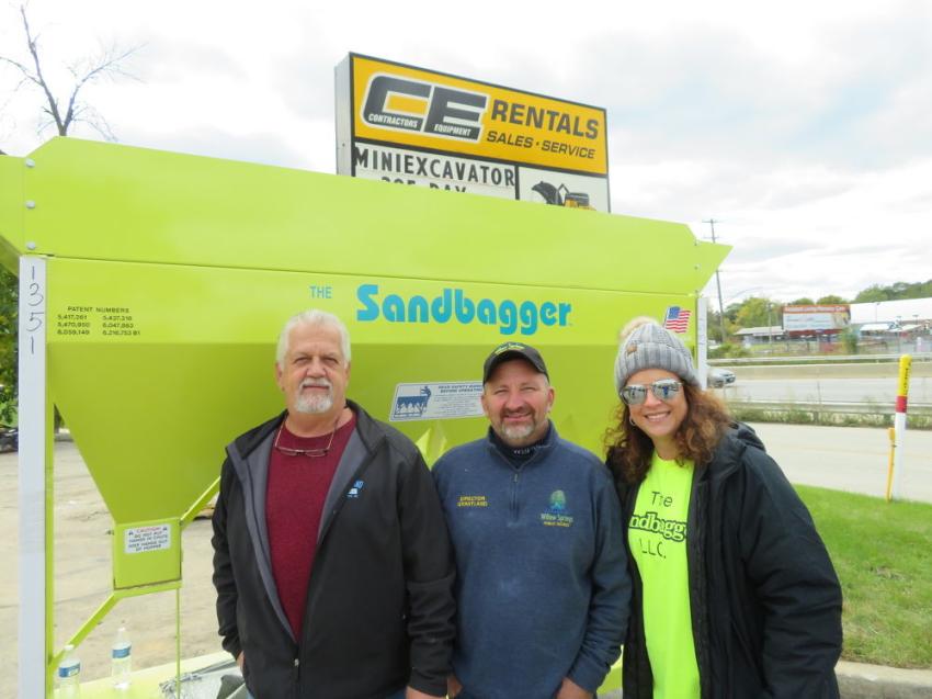 Mindy Restivo (R) of Sandbagger Corporation gets set to demo the Sandbagger model 1 for Fred Posch (L) and Keith Grantland, both of Willow Springs Public Works.
