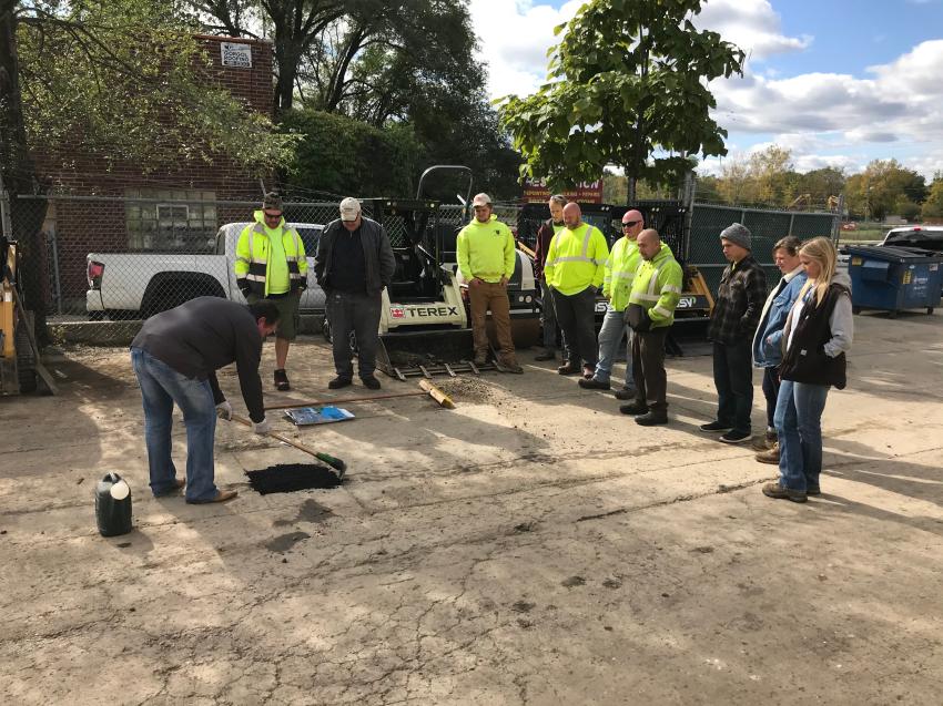 Public Works staff of Algonquin circle around CE Rentals sales representative Dave Gordon for a demonstration of the fast-working Aqua Patch pothole repair mix, sold exclusively by CE Rentals in Illinois. Gordon shows how one person can fix a pothole in as little as seven minutes. 
