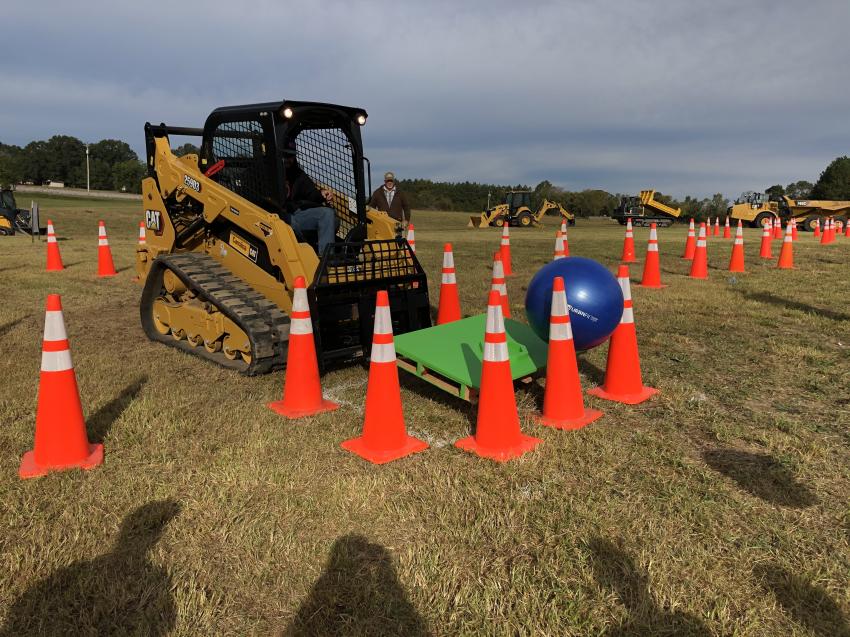 The obstacle course included carrying a beach ball on the deck using a Cat 259D3 compact track loader.