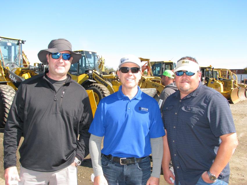 Discussing the lineup of heavy iron (L-R) are Dallas Robertson, Robertson Equipment International, Mt Pleasant, S.C.; Iron Auction Group’s Mike Finley; and Kenneth Tysinger, May Heavy Equipment, Lexington, N.C. 