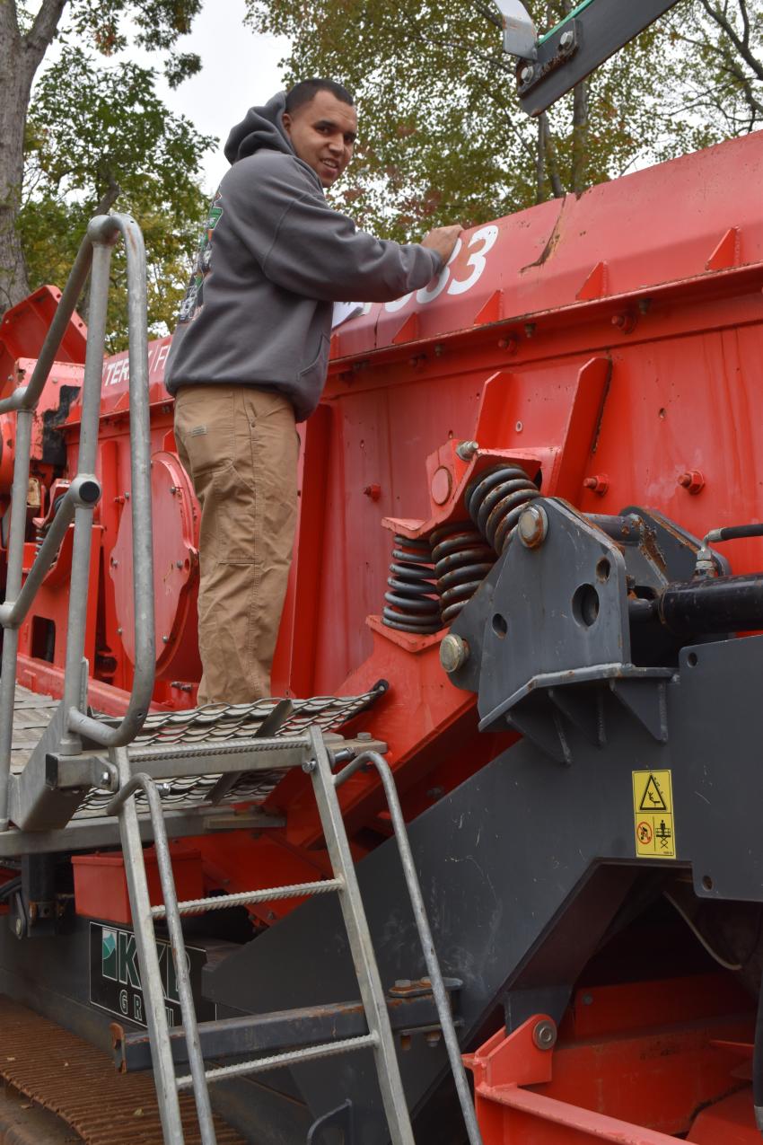 Jack Perry of HQ Dumpsters & Recycling in Southington, Conn., is closely inspecting a 2014 Terex Finlay model 83 screening plant.