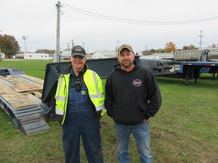 George Sherbondy (L) of H&H Land Clearing and Chris Vucetic of Hauser Services reviewed the trailers at the auction.