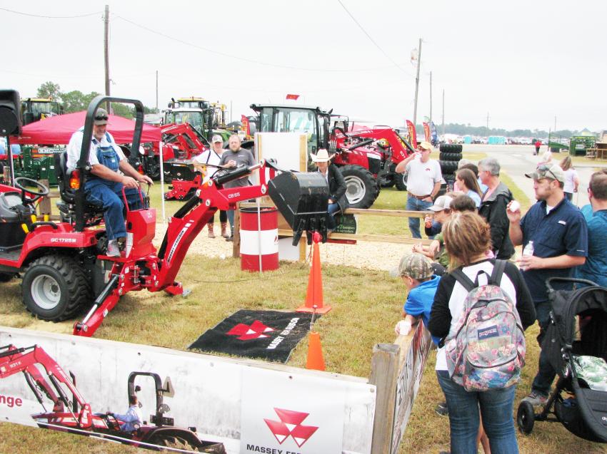 In a sea of static exhibits, attendees had the opportunity to operate a backhoe attachment on a Massey Ferguson GC1725M tractor in the AGCO exhibit area.