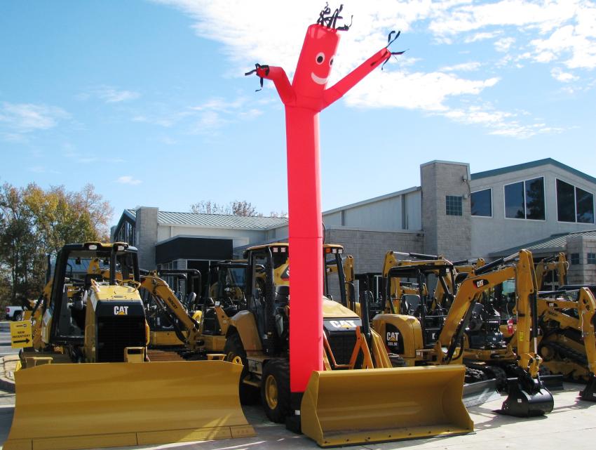 You’re at the right place when you see the floppy-dancing balloon guy bouncing around above a bunch of heavy equipment.