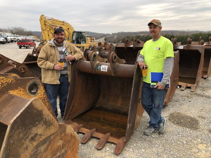 Looking over the excavator buckets are John Wolfenbarger (L) and Stacey Sexton of Sexton Construction in Maynardville, Tenn.
