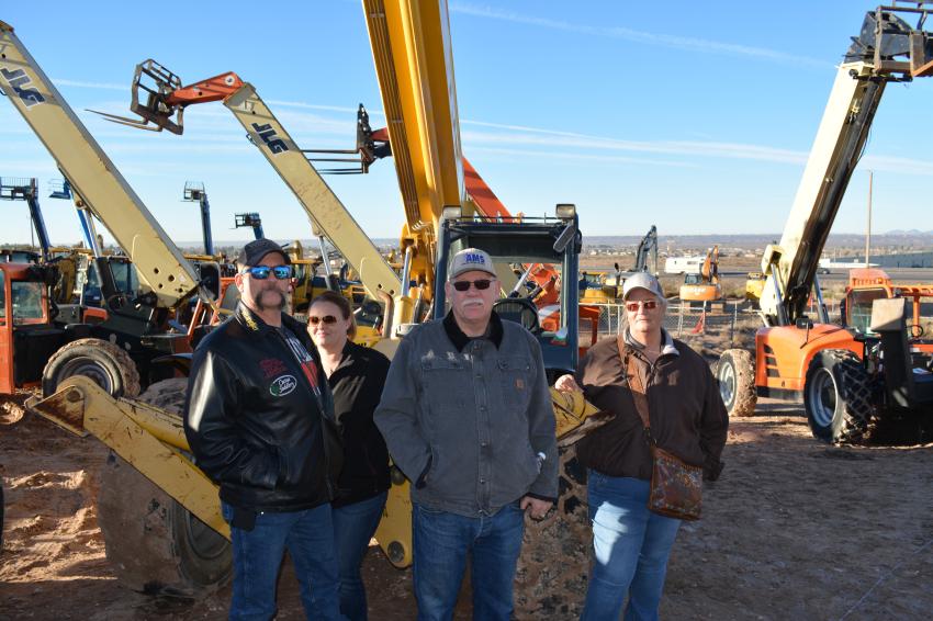 A huge inventory of lifts brought the entire ownership group of American Mechanical Solutions to the El Paso auction. After browsing the entire selection, they would bid on the Gehl DL11-55 telescopic forklift. (L-R) are Chad Lunsford, Leah Lunsford, Jerry Stockstill and Sharyl Stockstill of Clovis, N.M.
